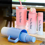 Set of pink and blue bottles with 'Tau Pei Bear' branding on a wooden surface.
